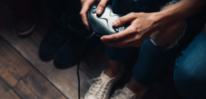 Young man clutching Xbox controller