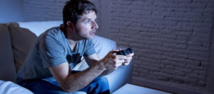 Young man hooked on gaming session